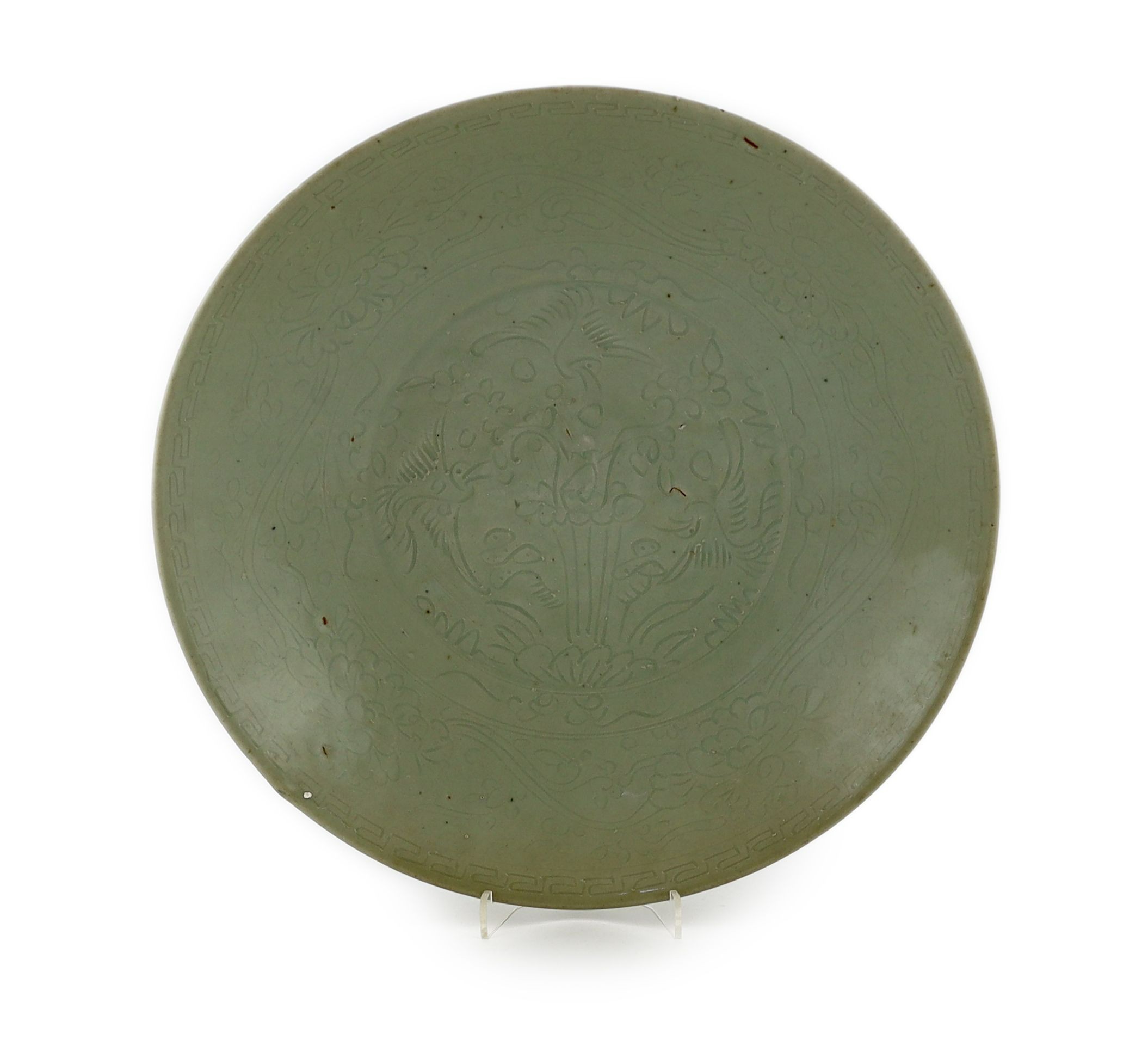 A Chinese celadon glazed sgraffito dish, Zhangzhou kilns, late 16th/early 17th century, 37cm diameter